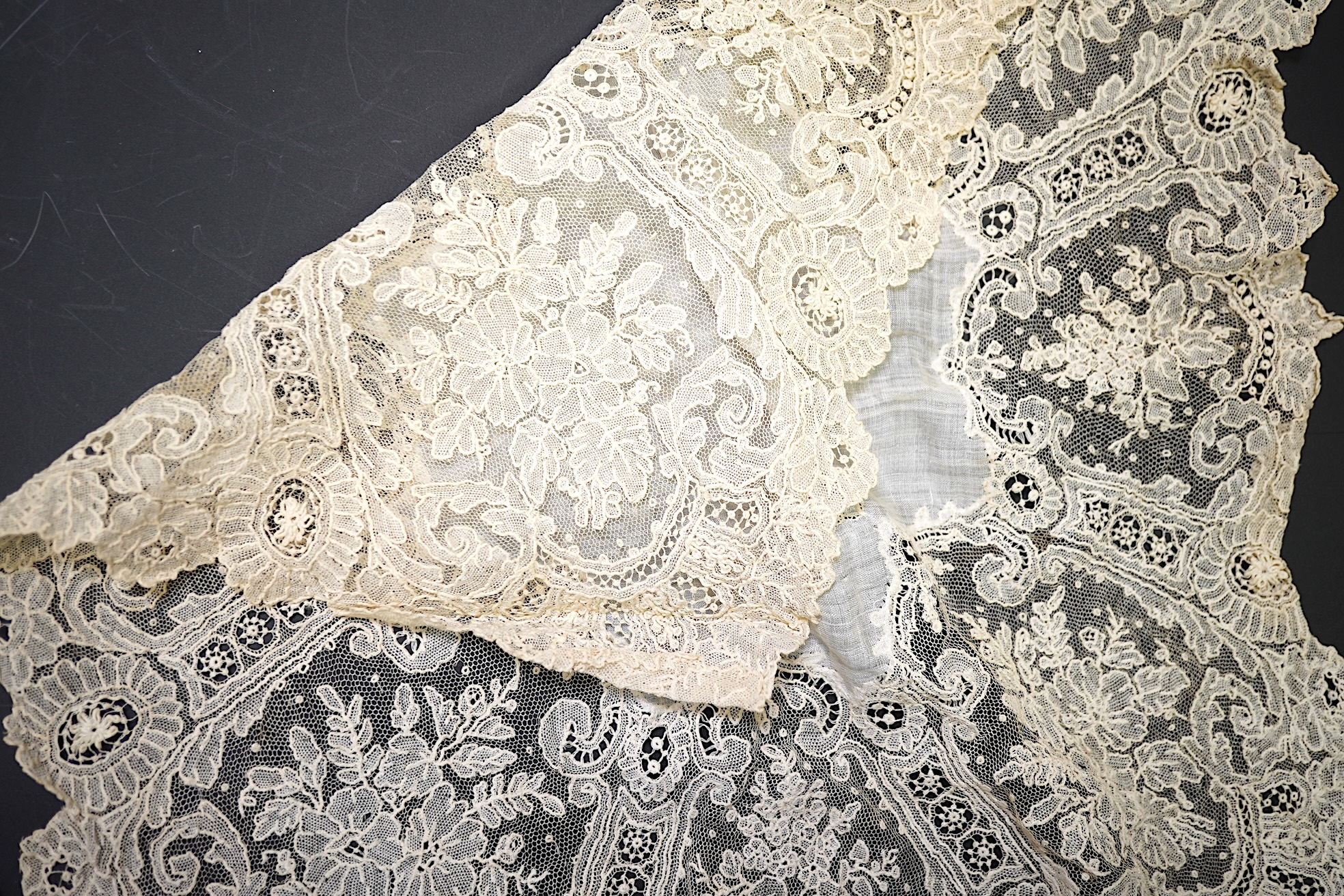 A 19th century Brussels Point de Gaz needle lace collar, lappet and wedding hankie, possibly part of a trousseau. The collar having thirty four needle lace raised flower heads within the design. The collar 100cm long x 1